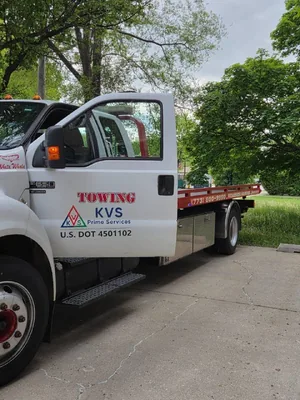 Cab door lettering reading TOWING, KVS Prime Services and U.S. DOT 4501102